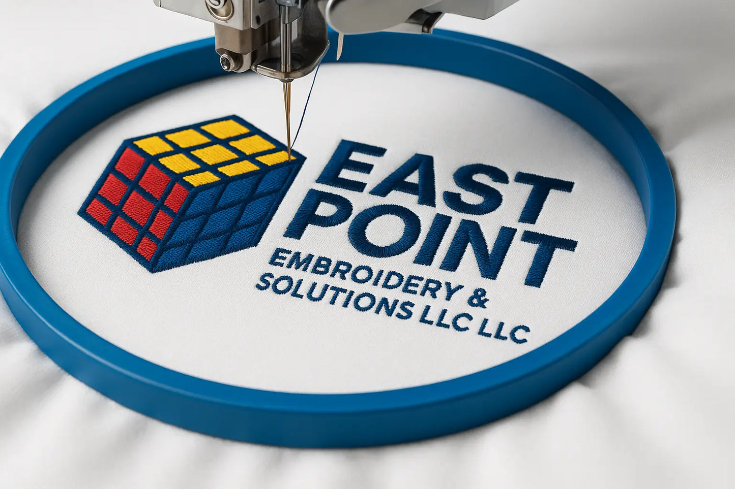 Custom embroidery machine stitching logo design at East Point Embroidery, Atlanta