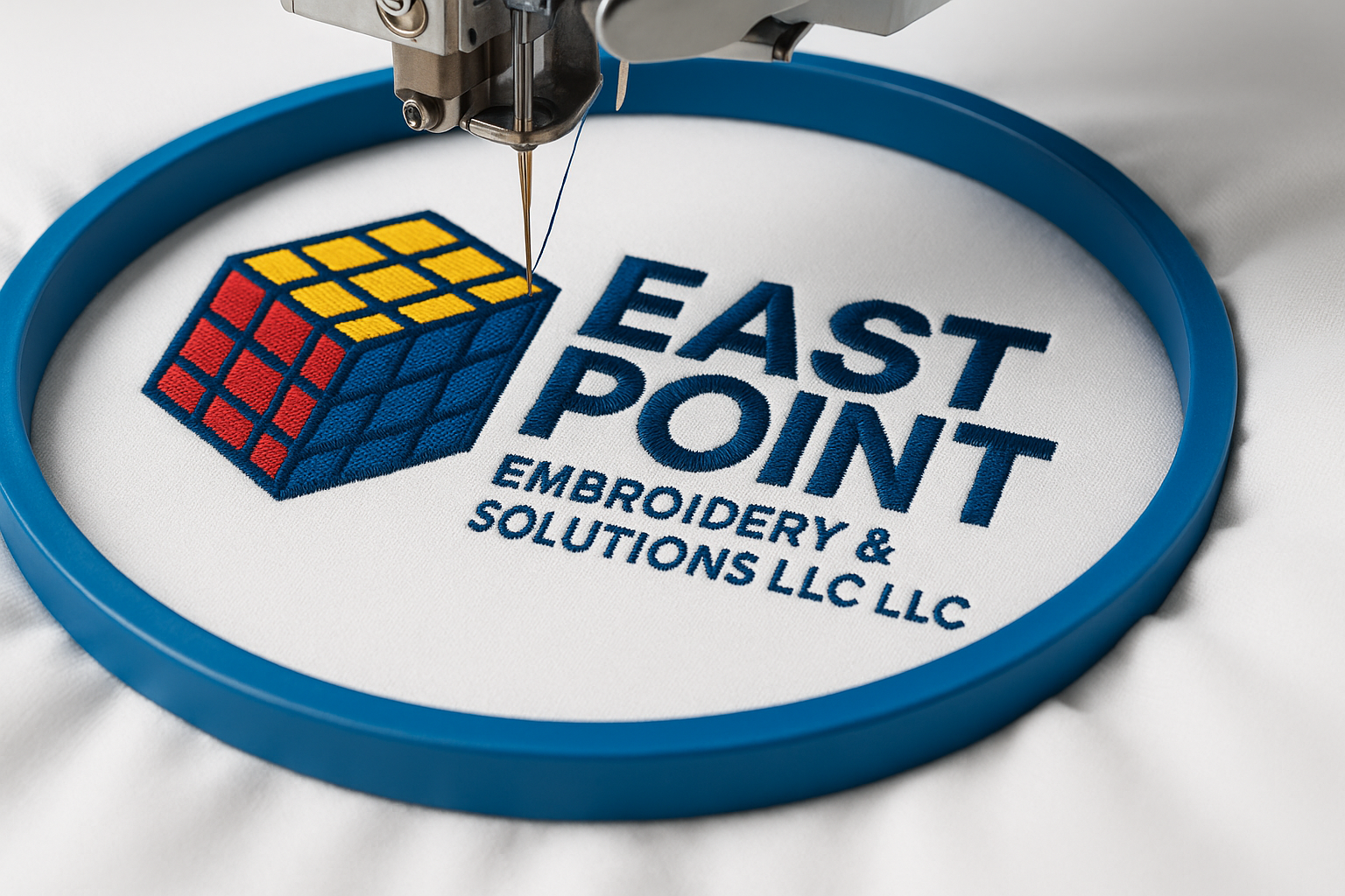 Custom embroidery machine stitching logo design at East Point Embroidery, Atlanta